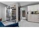 Spacious walk-in closet boasts custom shelving and cabinetry for organized storage and easy access to apparel at 1108 Pine Island Ct, Las Vegas, NV 89134