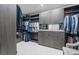 Well-organized walk-in closet with ample hanging space, shelving, drawers, and mirrored accents at 1108 Pine Island Ct, Las Vegas, NV 89134