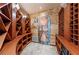 Rustic wine cellar featuring custom wood racks, and stone flooring at 1108 Pine Island Ct, Las Vegas, NV 89134