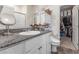Bathroom features vanity with granite countertop and storage, plus closet for extra linen and storage at 1174 King Lark St, Henderson, NV 89011