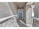 Inviting entryway with a stylish blue front door and stone accents at 1174 King Lark St, Henderson, NV 89011