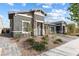 Stunning single-story home boasting a gray color scheme and low maintenance desert landscaping at 1174 King Lark St, Henderson, NV 89011