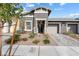 Well-manicured home featuring a lovely landscaped front yard and inviting curb appeal at 1174 King Lark St, Henderson, NV 89011
