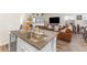 Open kitchen with stainless steel appliances, granite countertops, and seamless flow to living area at 1174 King Lark St, Henderson, NV 89011