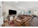 Cozy living room showcasing an open layout with hardwood floors and comfortable furnishings at 1174 King Lark St, Henderson, NV 89011