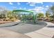 Modern outdoor playground with unique climbing structure and safety surfacing at 1174 King Lark St, Henderson, NV 89011