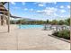 Community swimming pool with ample seating and mountain views in the background at 1174 King Lark St, Henderson, NV 89011