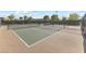Outdoor tennis courts featuring well-maintained green surface and surrounding fence at 1174 King Lark St, Henderson, NV 89011