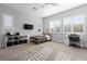 Bright bedroom featuring plantation shutters, ceiling fan, and a minimalist design at 12169 Castilla Rain Ave, Las Vegas, NV 89138