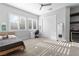 Bright bedroom featuring plantation shutters, ceiling fan, closet, and modern décor at 12169 Castilla Rain Ave, Las Vegas, NV 89138