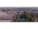 This aerial view showcases the neighborhood with a skyline backdrop of the city at 12169 Castilla Rain Ave, Las Vegas, NV 89138
