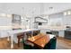 Kitchen with stainless appliances, large island, bar seating, and an adjacent dining area at 12169 Castilla Rain Ave, Las Vegas, NV 89138