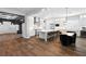 Open concept kitchen with white cabinetry, stainless appliances, and a large kitchen island at 12169 Castilla Rain Ave, Las Vegas, NV 89138