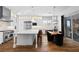 Kitchen with stainless appliances, large island, bar seating, and adjacent dining area at 12169 Castilla Rain Ave, Las Vegas, NV 89138