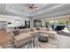 Spacious open-concept living space with a stylish kitchen, dining area, and comfortable seating, ideal for gatherings at 12169 Castilla Rain Ave, Las Vegas, NV 89138