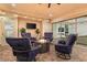Inviting covered patio with a cozy seating arrangement around a modern fire pit at 12169 Castilla Rain Ave, Las Vegas, NV 89138