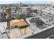 An aerial view of a charming home with a landscaped yard, driveway, and surrounding neighborhood at 1408 E Carson Ave, Las Vegas, NV 89101