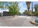 Open backyard with a concrete pad and gravel at 1408 E Carson Ave, Las Vegas, NV 89101