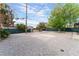 Large backyard area with gravel, concrete, and a nice shade tree at 1408 E Carson Ave, Las Vegas, NV 89101