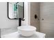 Close-up of a stylish bathroom vanity with a bowl sink, sleek faucet, and modern finishes at 1408 E Carson Ave, Las Vegas, NV 89101