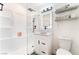 Modern bathroom with a glass shower, vanity with bowl sink, and floating shelves, offering a clean and contemporary design at 1408 E Carson Ave, Las Vegas, NV 89101