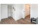 Open bedroom with wood-look flooring, closet and doorways, creating a spacious and versatile area at 1408 E Carson Ave, Las Vegas, NV 89101