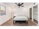 Bright bedroom features wood floors, closet space, a ceiling fan, and a neutral color palette at 1408 E Carson Ave, Las Vegas, NV 89101