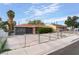 Single-story home with desert landscaping and a red front door at 1408 E Carson Ave, Las Vegas, NV 89101