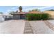 Charming single-story home with desert landscaping and a concrete driveway at 1408 E Carson Ave, Las Vegas, NV 89101
