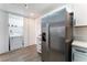 Kitchen area featuring a stainless steel refrigerator and easy access to laundry room at 1408 E Carson Ave, Las Vegas, NV 89101