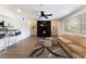 Bright living room with fireplace, ceiling fan, modern decor and wood floors and access to the kitchen at 1408 E Carson Ave, Las Vegas, NV 89101