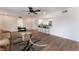 Bright living room with wood floors, comfortable seating, and an open concept to a kitchen and dining area at 1408 E Carson Ave, Las Vegas, NV 89101