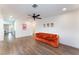 Spacious living room with hardwood flooring, ceiling fan, and neutral colored walls at 1408 E Carson Ave, Las Vegas, NV 89101