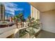 Balcony with city views, palm trees, and a seating area at 145 E Harmon Ave # 201, Las Vegas, NV 89109