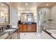 Elegant bathroom with double vanities, a soaking tub, and a separate glass shower at 145 E Harmon Ave # 201, Las Vegas, NV 89109
