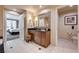 Bathroom with a vanity, toilet, and an open doorway to a bedroom at 145 E Harmon Ave # 201, Las Vegas, NV 89109