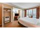 Sunlit bedroom with a large window offering expansive city views at 145 E Harmon Ave # 201, Las Vegas, NV 89109