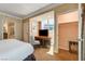 Well-lit bedroom featuring a desk area and ample closet space at 145 E Harmon Ave # 201, Las Vegas, NV 89109