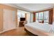 This hotel bedroom features city views from large windows, cozy seating, and a plush king bed at 145 E Harmon Ave # 201, Las Vegas, NV 89109