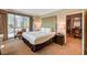 Charming bedroom features city views from large windows and a comfortable king bed at 145 E Harmon Ave # 201, Las Vegas, NV 89109