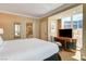 Comfortable bedroom with a desk area and large windows overlooking the city at 145 E Harmon Ave # 201, Las Vegas, NV 89109