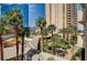 View of city buildings and palm trees from a balcony at 145 E Harmon Ave # 201, Las Vegas, NV 89109