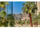 View of city buildings and palm trees at 145 E Harmon Ave # 201, Las Vegas, NV 89109