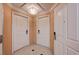 Hallway with white doors and neutral walls at 145 E Harmon Ave # 201, Las Vegas, NV 89109