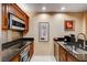 Modern kitchen equipped with stainless steel appliances and dark countertops at 145 E Harmon Ave # 201, Las Vegas, NV 89109
