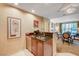 This kitchenette offers granite counters, stainless appliances, and rich wood cabinetry at 145 E Harmon Ave # 201, Las Vegas, NV 89109