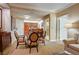 Living room featuring a dining area, and partial view of the kitchen and bathroom at 145 E Harmon Ave # 201, Las Vegas, NV 89109