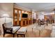 Open-concept space with a comfortable seating area, entertainment center, and partial view of the kitchen at 145 E Harmon Ave # 201, Las Vegas, NV 89109