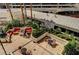 Charming outdoor seating area with comfortable furniture, lush plants, and string lights for ambiance at 145 E Harmon Ave # 201, Las Vegas, NV 89109