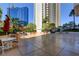 Spacious outdoor patio with ample seating and lush greenery, perfect for relaxing and enjoying the views at 145 E Harmon Ave # 201, Las Vegas, NV 89109